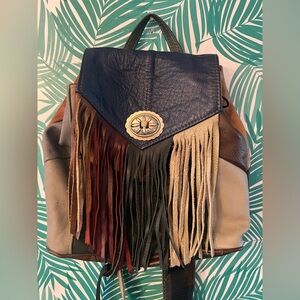 Western leather patchwork backpack fringe detail metal conch  purse multi color